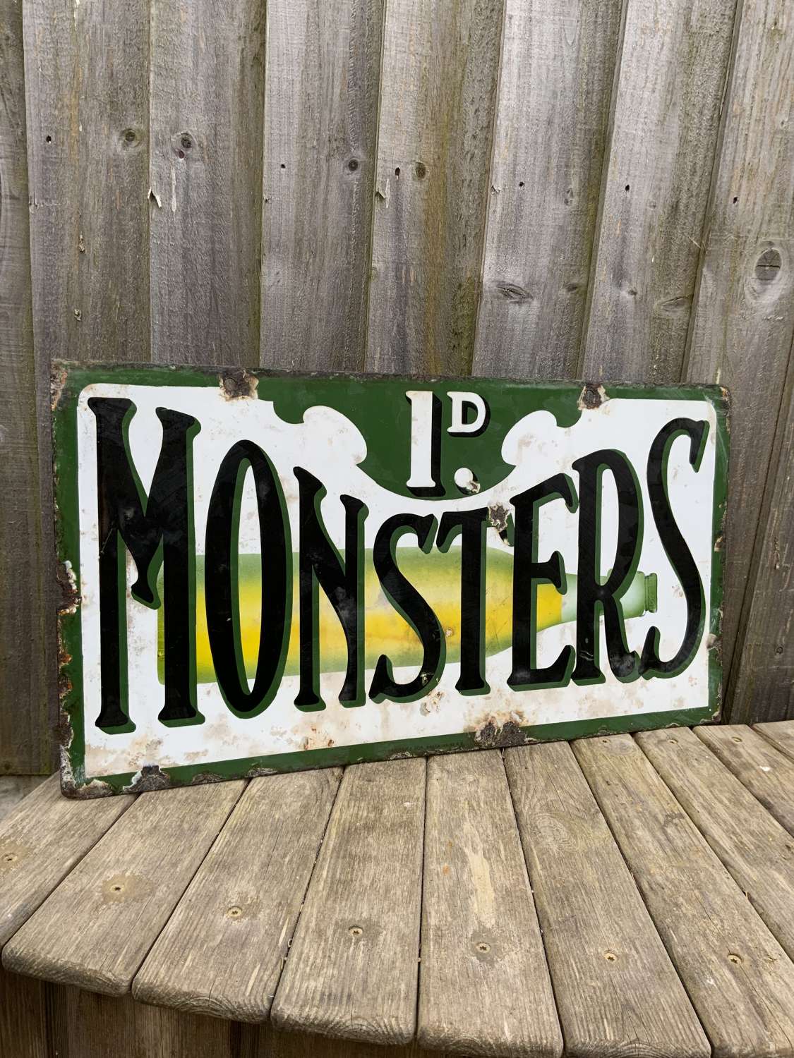 Penny monsters enamel advertising sign