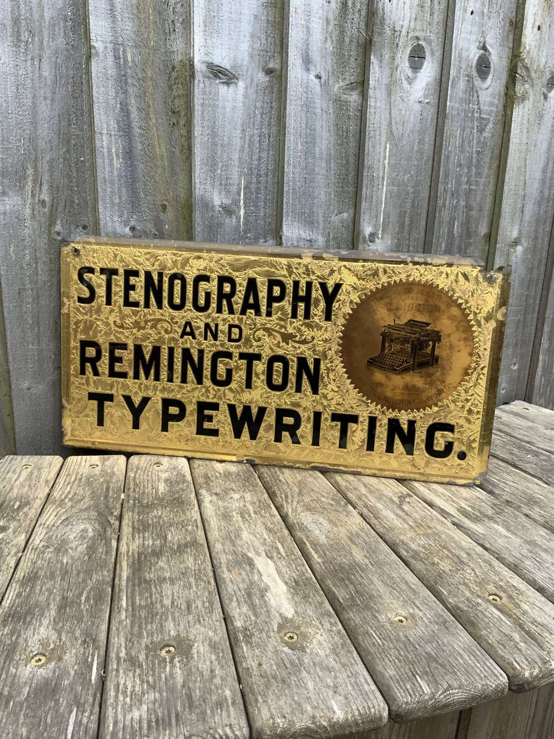 Very early stunning gold leaf Remington glass advertising sign