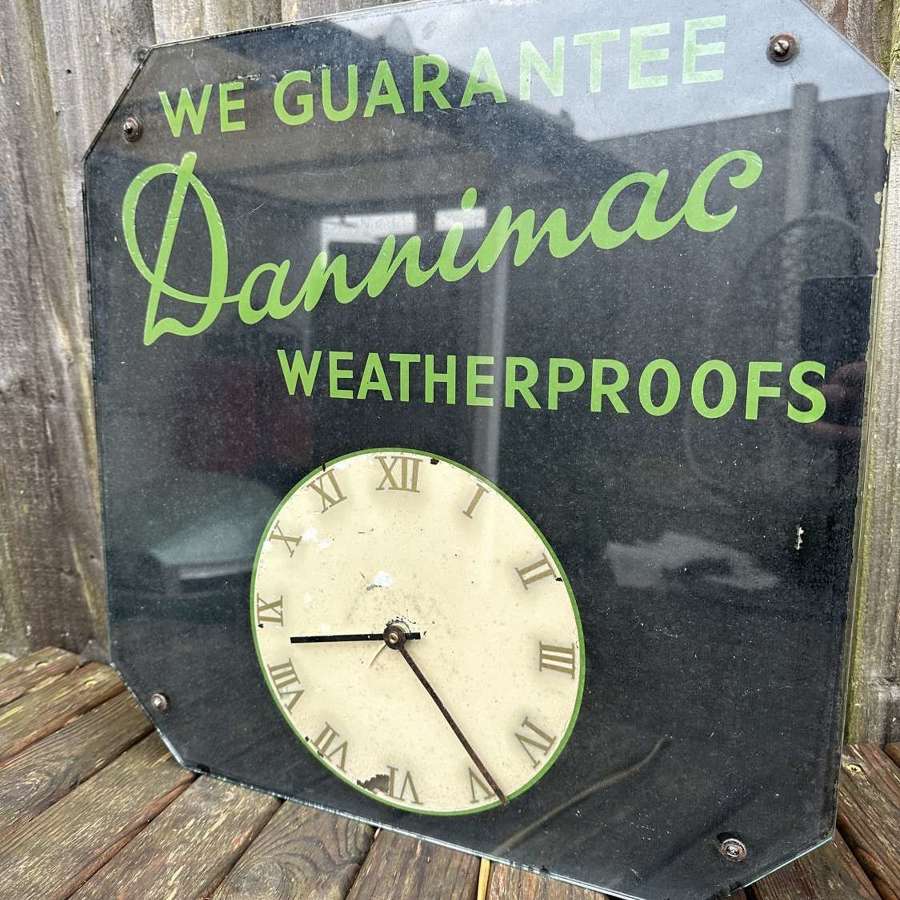 Unusual glass advertising clock for raincoats