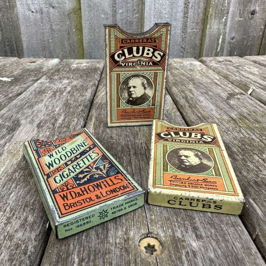 Group of 3 paper cigarette pack holders.