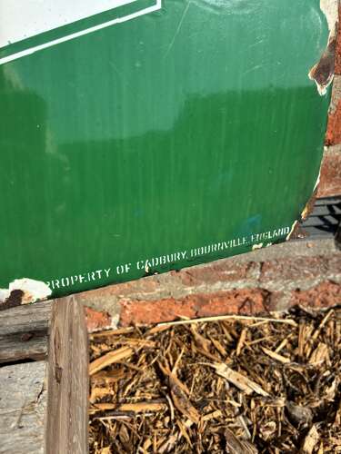 Green Cadburys cocoa enamel advertising sign